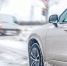 crossover-winter-slush-near-intersection-with-blurred-traffic-urban-safety - ТРК Щелково
