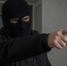 Criminals wear a mask in black on a gray background. - Газета Магаданская правда