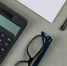 financial-concept-with-notebook-paper-pen-calculator-keyboard-glasses-grey-background-flat-lay.jpg - Центр Мой бизнес