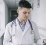 young-doctor-with-papers-standing-clinic.jpg - Gorod3466.Ru