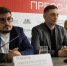 На фото запечатлены спикеры, сидящие за столом на пресс-конференции в Челябинском областном пресс-центре — перед ними установлены микрофоны и именные таблички - Коркинский муниципальный округ