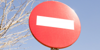 red-stop-street-sign-front-bare-tree-blue-sky_1_1.jpg - GorodnaBire.Ru