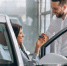 salesman-woman-looking-car-car-showroom_1.jpg - GorodnaBire.Ru