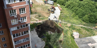 Фоторепортаж из «портала в ад»: 15 метров до дна коммунальной аварии на Горском в Новосибирске - Сиб.фм