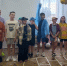 Группа детей. На полу - игра Классики - Кондинский район