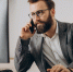 young-business-man-talking-phone-working-computer.jpg - Центр Мой бизнес