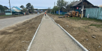 В курортном поселке Бурятии укладывают нижний слой асфальтобетонного покрытия - Министерство по развитию транспорта, энергетики и дорожного хозяйства
