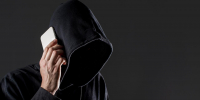 side-view-male-hacker-talking-smartphone-with-copy-space_4_1_1.jpg - GorodnaBire.Ru