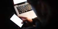 concentrated-man-using-laptop-computer-phone_1.jpg - GorodnaBire.Ru