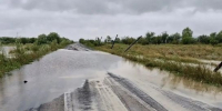 Вода вышла на трассу в Магдагачинском округе Приамурья - ИА Порт Амур