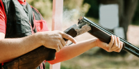 man-opens-shotgun-bolt-after-one-shot-with-smoke.jpg - Gorod3466.Ru