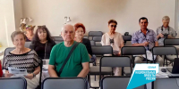 Подопечные старшего возраста слушают лекцию по финансовой безопасности - Министерство труда и соцразвития