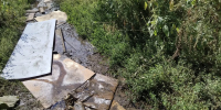 Грязная вода вместо дороги: жители улицы Навашина обратились за помощью - ЛДПР