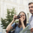 cute-tourist-couple-taking-pictures-with-camera_1.jpg - GorodnaBire.Ru