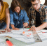 Female,Designers,Discussing,Over,Blueprint,With,Male,Designer.,One,Of - Газета Восход