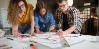Female,Designers,Discussing,Over,Blueprint,With,Male,Designer.,One,Of - Газета Восход