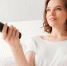 happy-young-lady-sitting-indoors-home-watch-tv_1.jpg - GorodnaBire.Ru