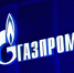 На тёмно‑синем фоне размещён объёмный логотип компании «Газпром» с фирменным символом в виде стилизованного пламени. - Коркинский муниципальный округ