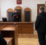 зал суда: судья в мантии за трибуной зачитывает документ; стоящий подсудимый, сотрудник в форме возле клетки для подсудимых, прокурор за столом - 168.Ru