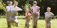 best-friends-having-contest-with-burlap-bags (1) - Контрольно-счетная палата