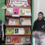 Книжная выставка на стеллаже с книгами Сергея Аксакова в детском отделе библиотеки; рядом два мальчика у стойки экспозиции. - 168.Ru